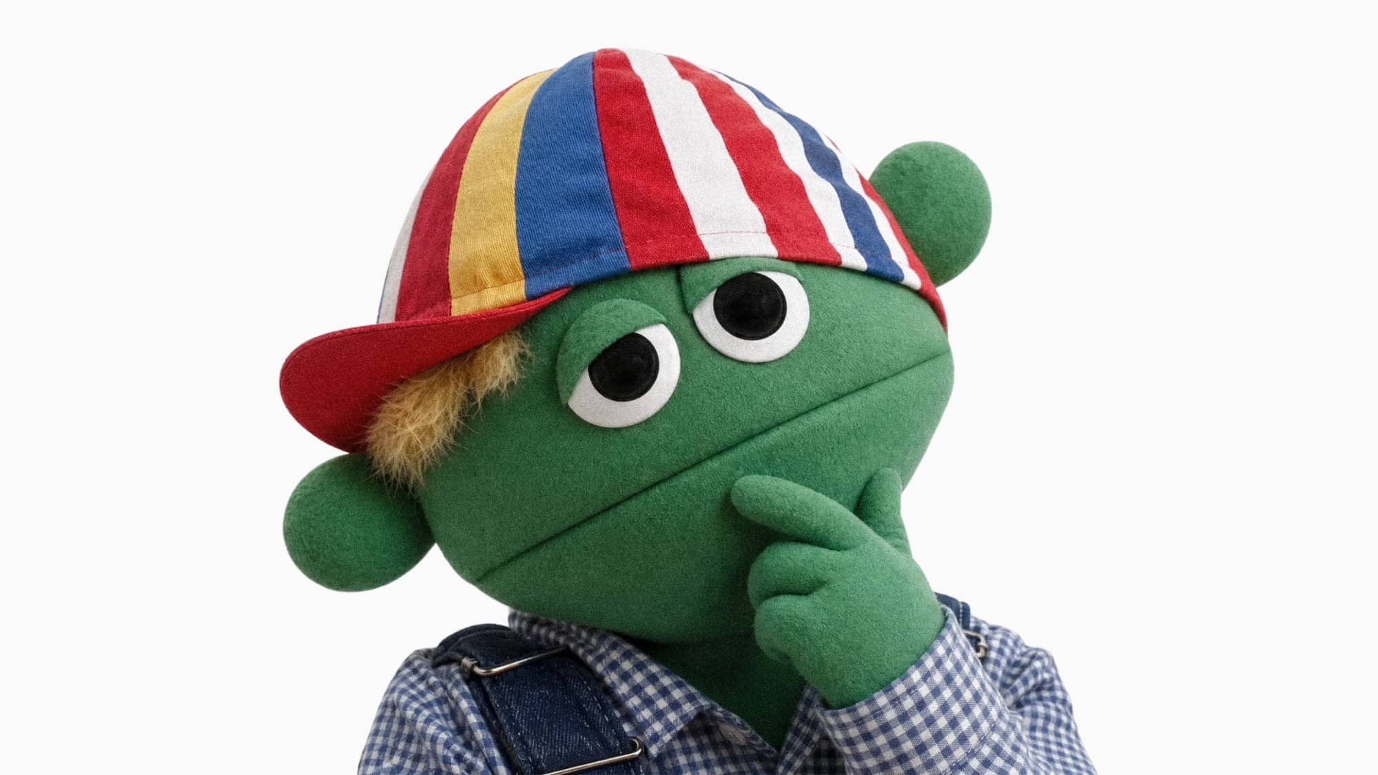 Skurt, en grön, grodliknande tygdocka