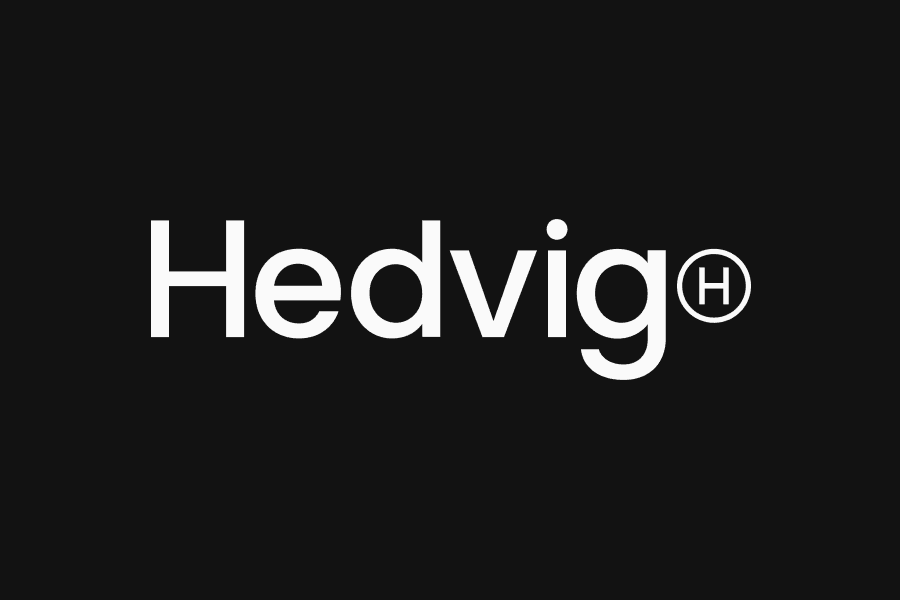 Hedvigs logotyp mot mörk bakgrund